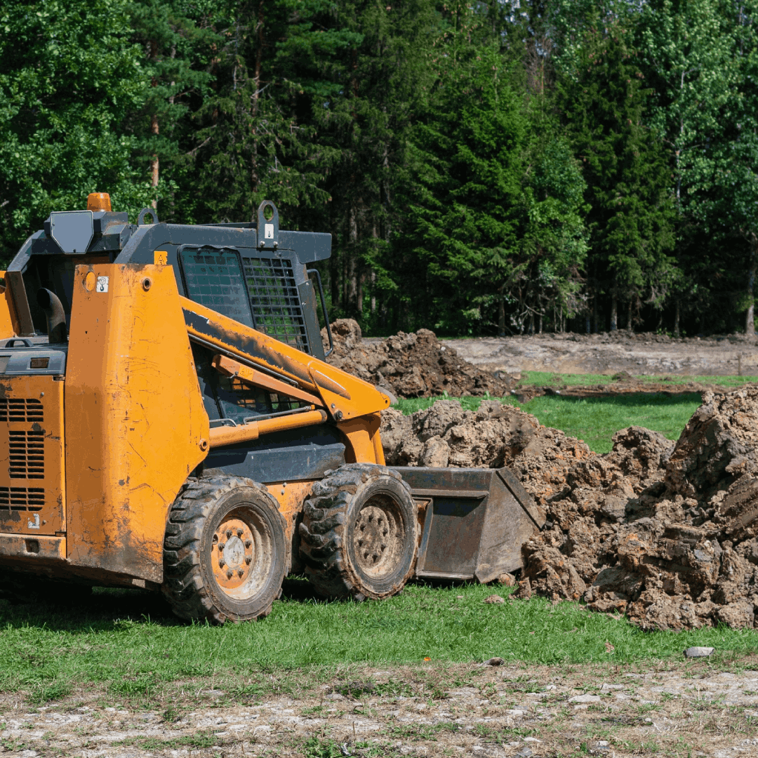 excavator working on the construction site of a new residential building<br />
